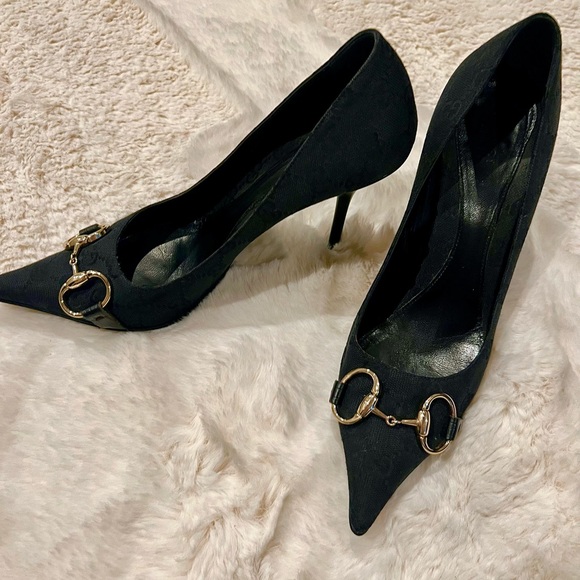 Gucci Shoes - Gucci Women’s pumps. Classic GG logo. Black with gold hard wear. Size 8.